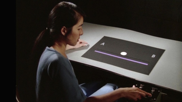 Woman moving discs to make animation